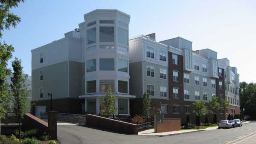 Completed roofing on a multi-story commercial apartment building